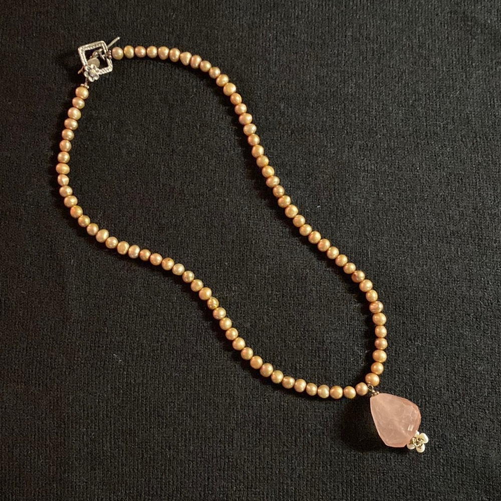 Dainty topaz color heads with a crystal looking pendant